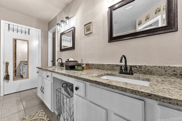 bathroom with vanity and tile patterned floors