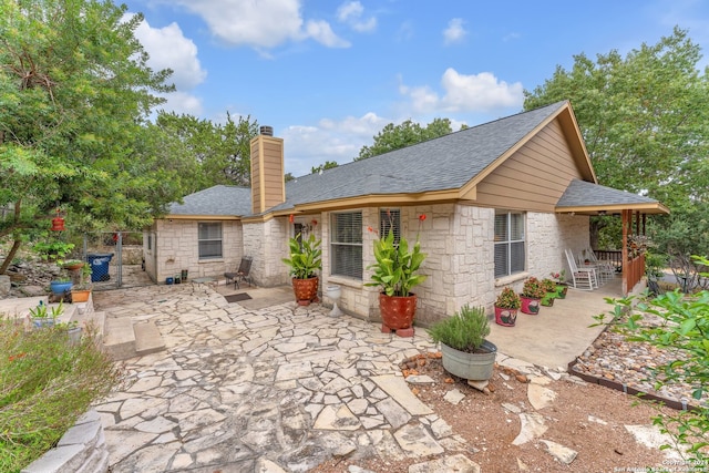 rear view of house featuring a patio area