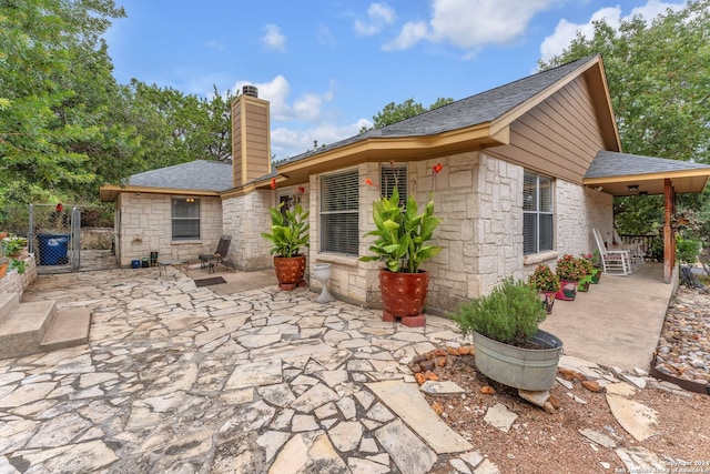 back of house with a patio area