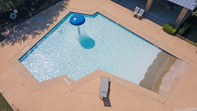 view of swimming pool with a patio