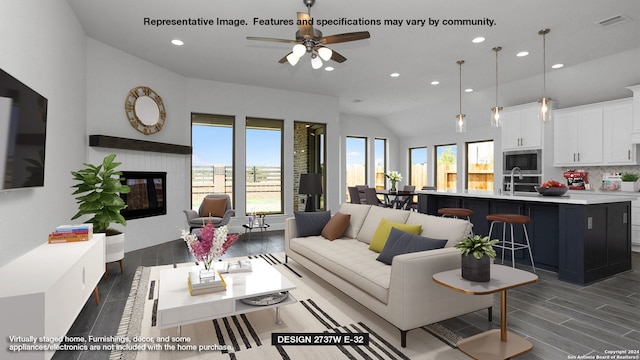 living room with dark hardwood / wood-style flooring, a wealth of natural light, vaulted ceiling, and ceiling fan