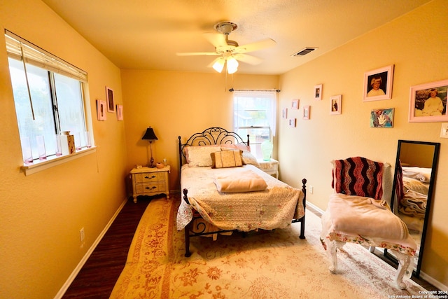 bedroom featuring hardwood / wood-style floors and ceiling fan