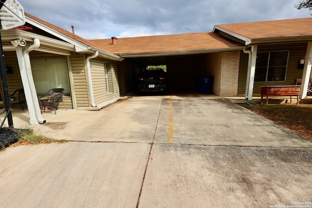 view of property exterior with a carport