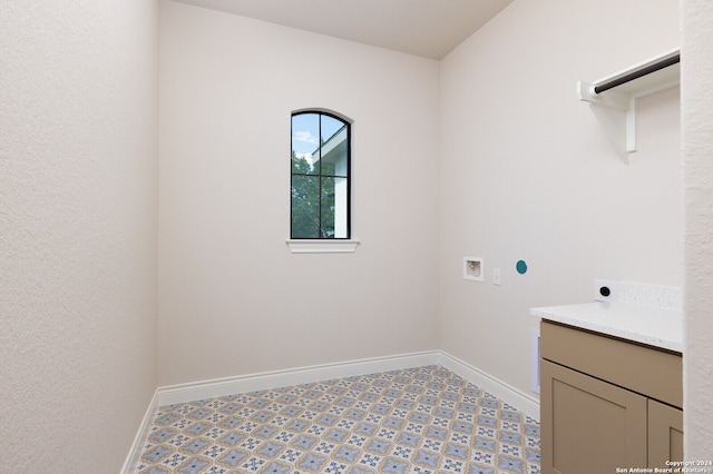 laundry room featuring hookup for an electric dryer, cabinets, and hookup for a washing machine