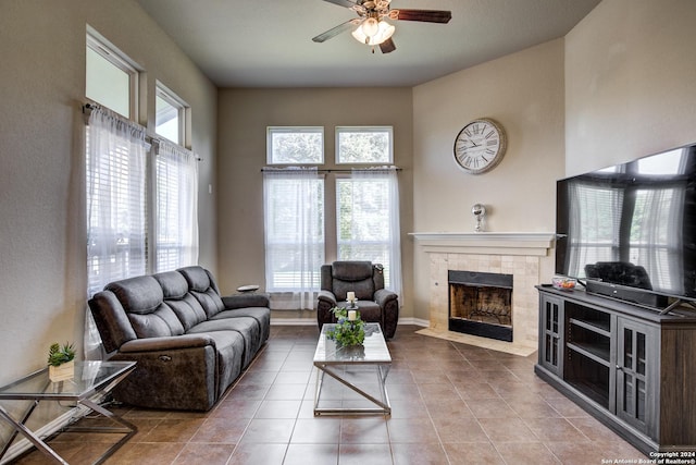 8811 Falcon Park, Converse, TX 78109 - living area with a ceiling fan, a tile fireplace, tile patterned flooring, and healthy amount of natural light