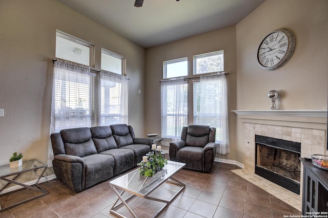8811 Falcon Park, Converse, TX 78109 - living area featuring healthy amount of natural light, a tile fireplace, tile patterned flooring, and a ceiling fan
