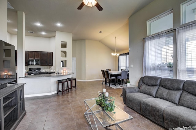 8811 Falcon Park, Converse, TX 78109 - living room featuring high vaulted ceiling, tile patterned flooring, a ceiling fan, a chandelier, and baseboards