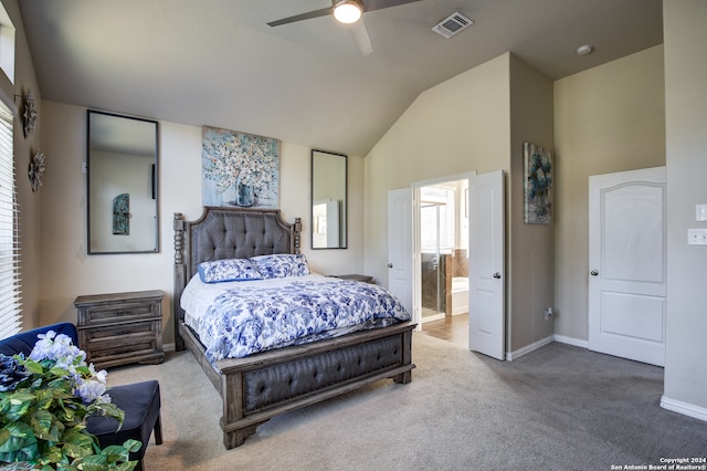 bedroom featuring ensuite bathroom, carpet, lofted ceiling, and ceiling fan