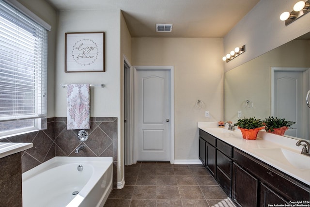 8811 Falcon Park, Converse, TX 78109 - bathroom with double vanity, plenty of natural light, a bath, and tile patterned floors