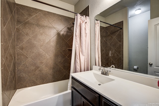 bathroom with vanity and shower / bath combo