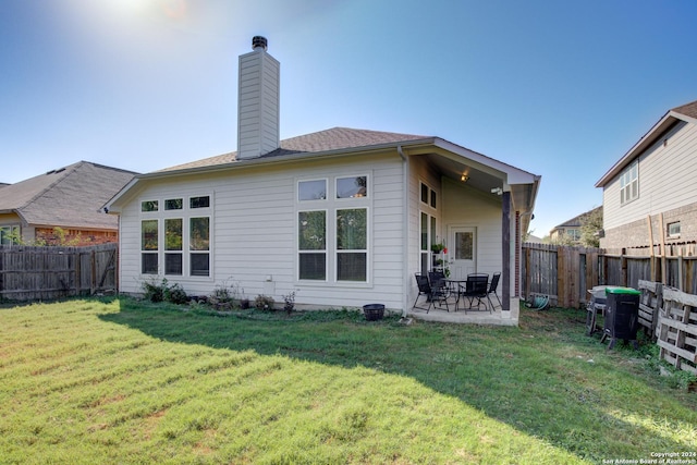 8811 Falcon Park, Converse, TX 78109 - rear view of house with a chimney and a patio area
