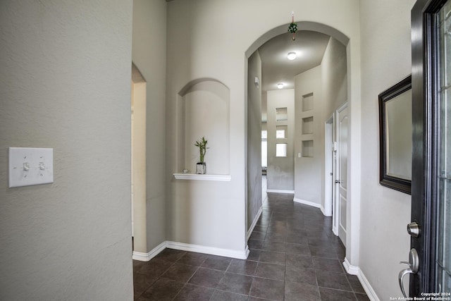 8811 Falcon Park, Converse, TX 78109 - hallway featuring dark tile patterned floors and baseboards
