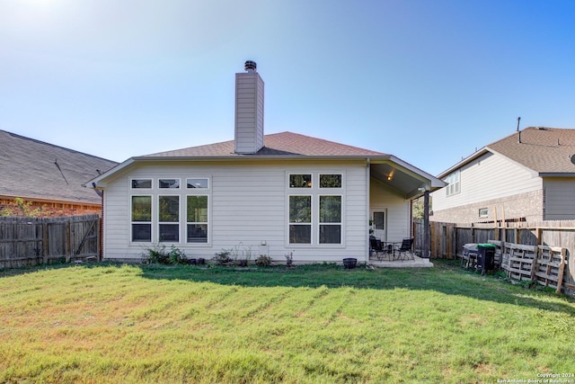8811 Falcon Park, Converse, TX 78109 - back of property with a chimney and a patio area