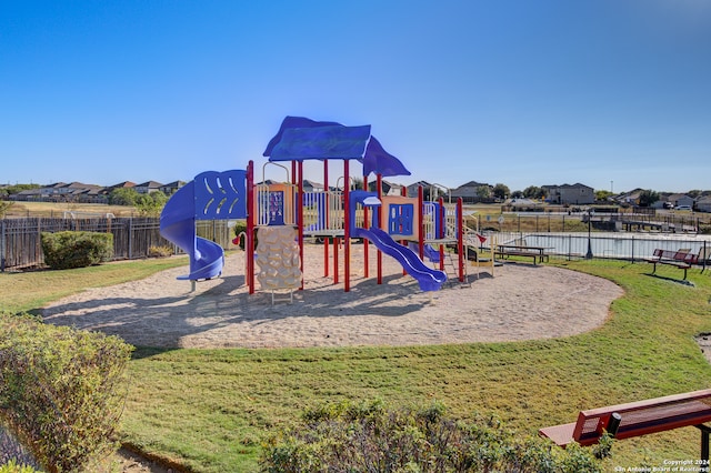 view of play area featuring a lawn