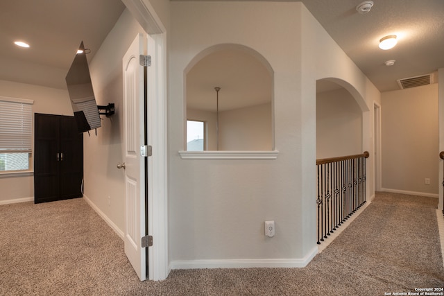 corridor featuring carpet flooring