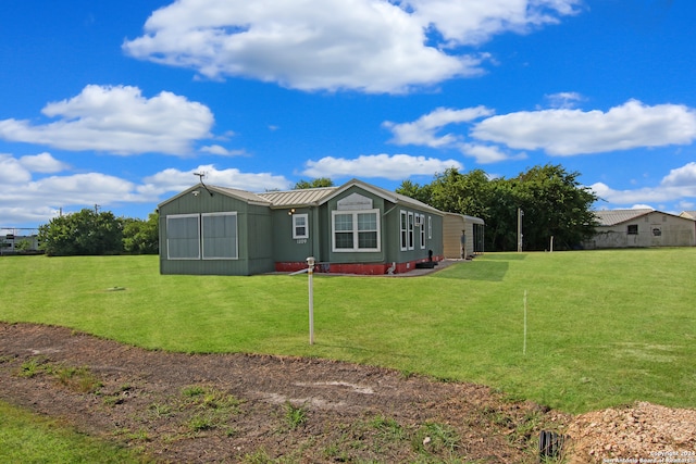 view of property exterior featuring a lawn