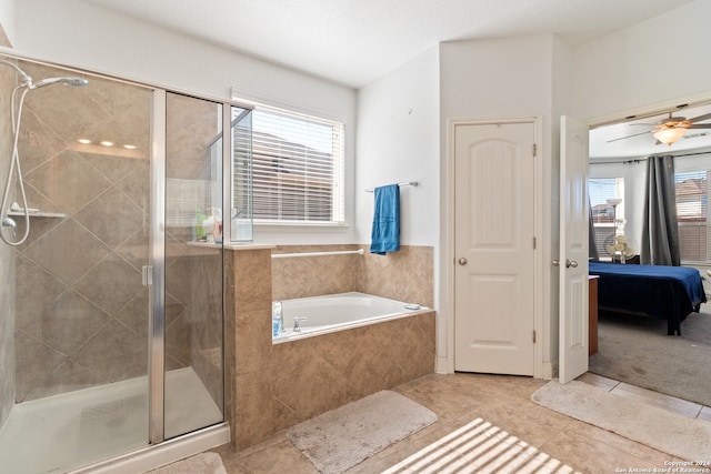 bathroom featuring a healthy amount of sunlight, tile patterned floors, and separate shower and tub