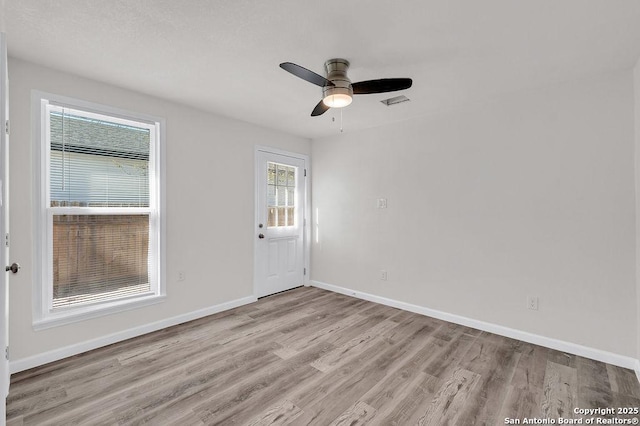 unfurnished room with light hardwood / wood-style floors and ceiling fan