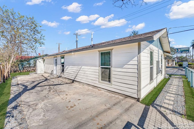 back of house with a patio