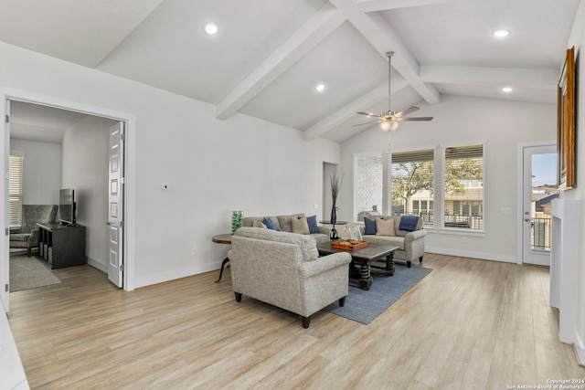 living room featuring light hardwood / wood-style flooring, vaulted ceiling with beams, and ceiling fan