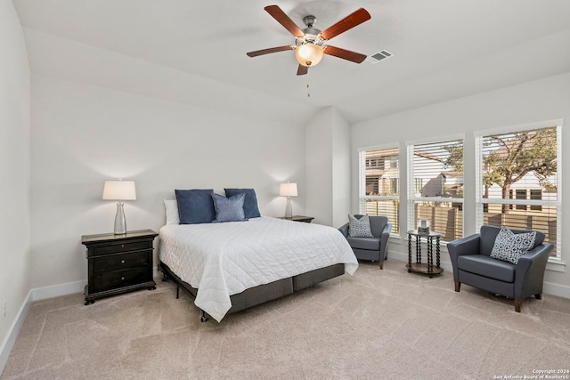 bedroom with light carpet and ceiling fan