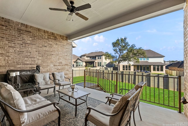 view of patio / terrace featuring ceiling fan and an outdoor living space