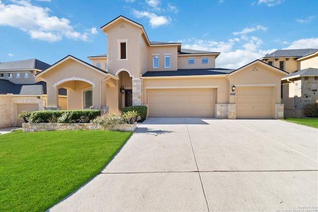 view of front of house featuring a garage and a front yard