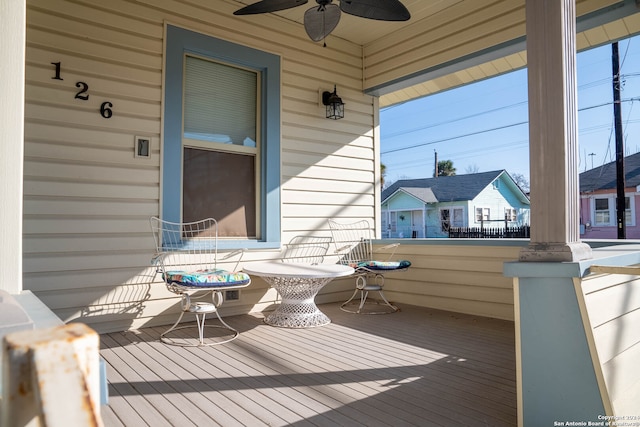 wooden deck with ceiling fan