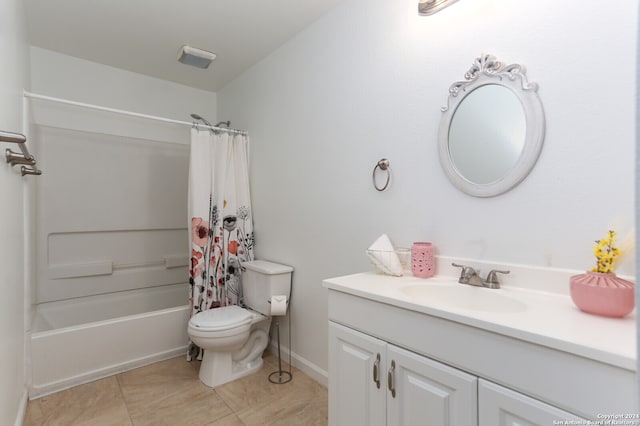 full bathroom featuring shower / tub combo with curtain, vanity, toilet, and tile patterned flooring