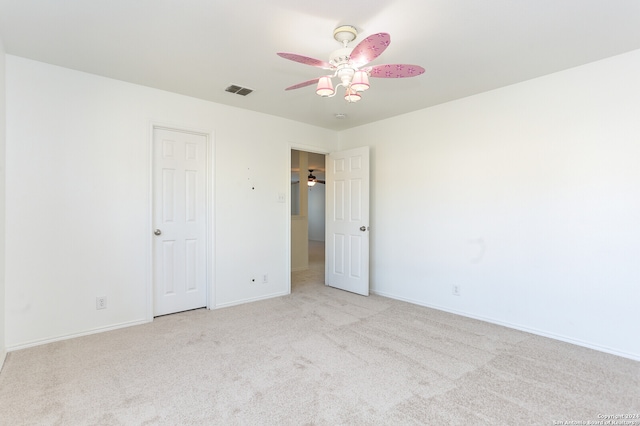 unfurnished room with light carpet