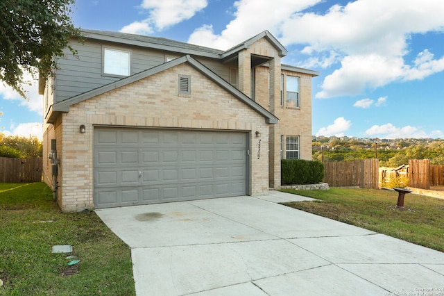 view of property with a garage and a front yard