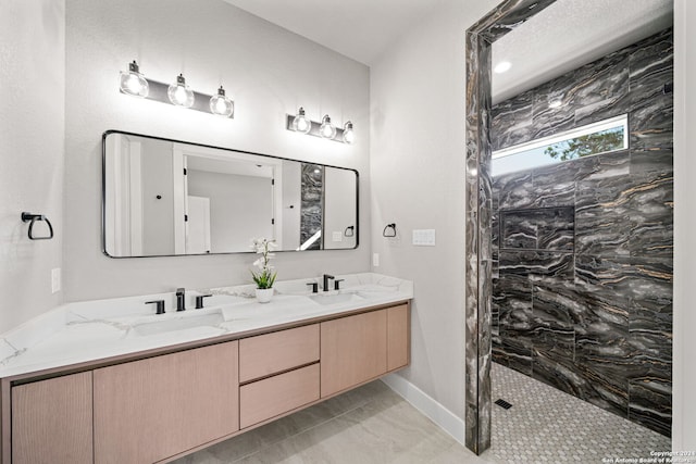 2920 Rocky Ridge Loop, Canyon Lake, TX 78133 - bathroom with double vanity, walk in shower, baseboards, and marble look tile flooring