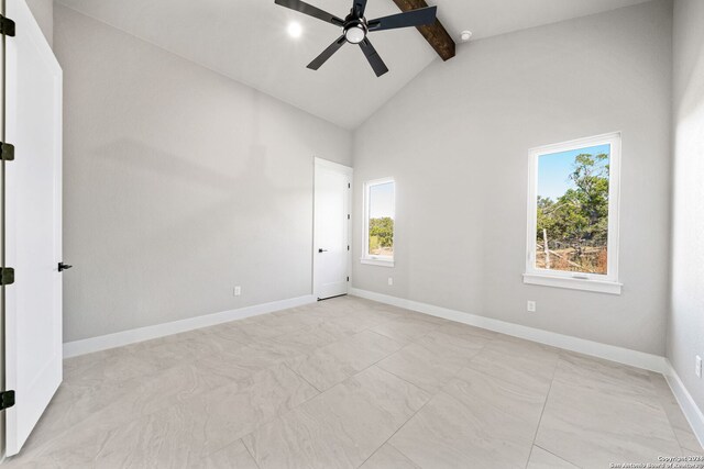 2920 Rocky Ridge Loop, Canyon Lake, TX 78133 - spare room featuring beam ceiling, plenty of natural light, ceiling fan, high vaulted ceiling, and baseboards