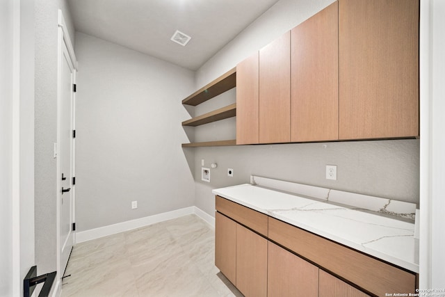 2920 Rocky Ridge Loop, Canyon Lake, TX 78133 - washroom with electric dryer hookup, washer hookup, baseboards, and cabinet space
