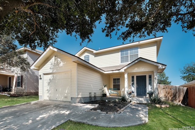 view of front facade featuring a garage and a front lawn