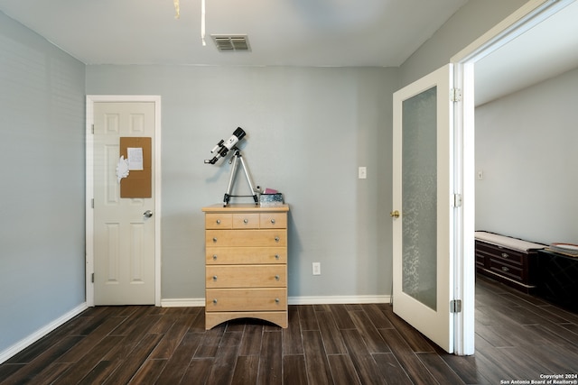 corridor featuring dark hardwood / wood-style flooring