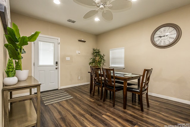 dining room with ceiling fan and dark hardwood / wood-style flooring