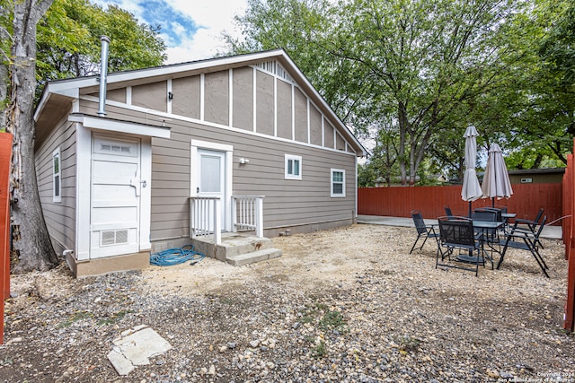 back of house with a patio area