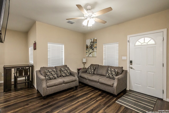 living room featuring dark hardwood / wood-style floors and ceiling fan