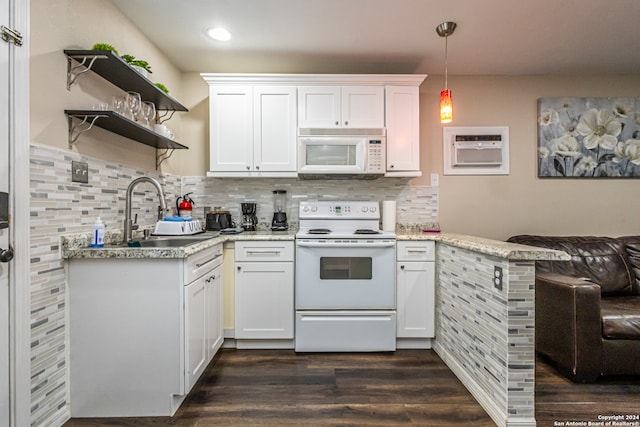 kitchen featuring sink, decorative light fixtures, white appliances, white cabinets, and dark wood-type flooring