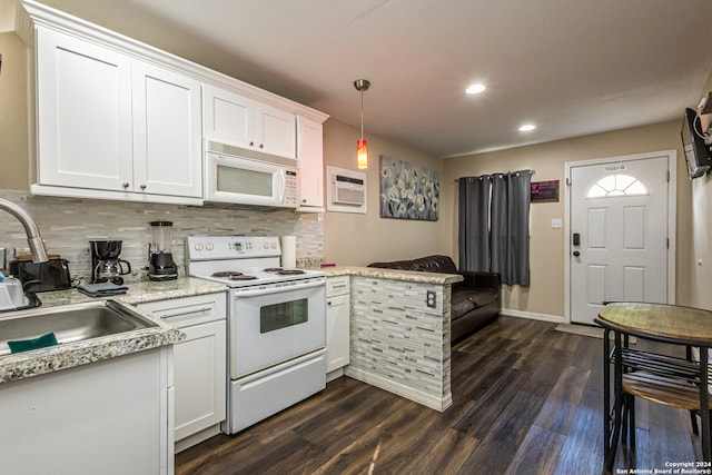 kitchen featuring dark hardwood / wood-style flooring, pendant lighting, white appliances, and white cabinets