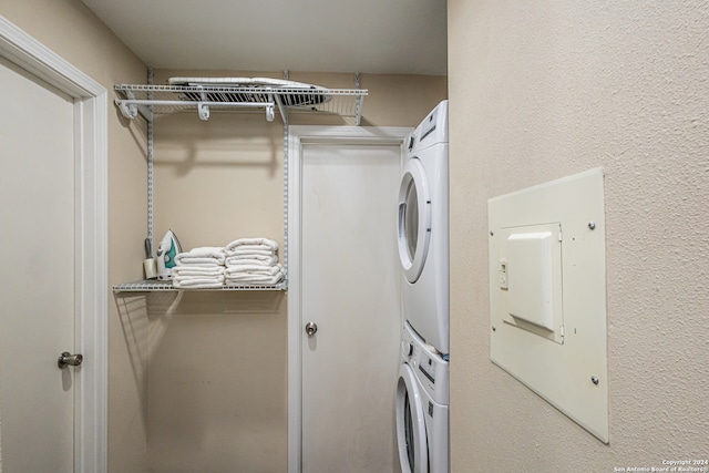 laundry room featuring stacked washer / dryer