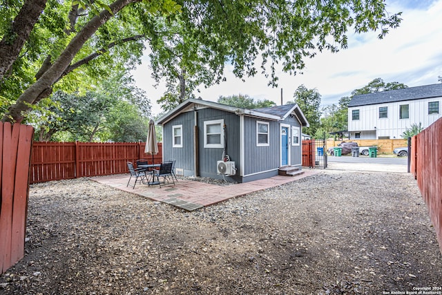 back of property with a patio