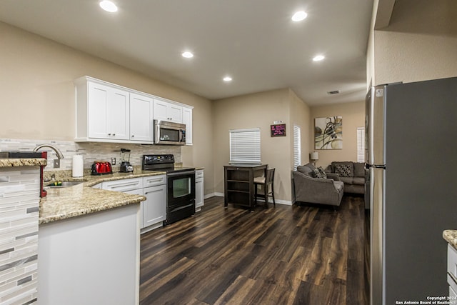 kitchen featuring white cabinetry, sink, dark hardwood / wood-style floors, and stainless steel appliances