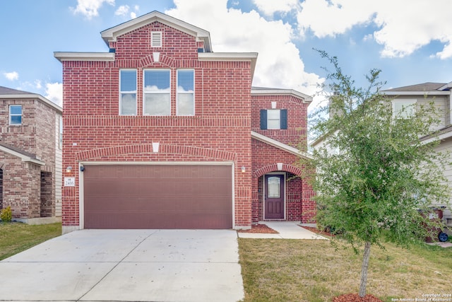 view of front of house featuring a garage and a front yard