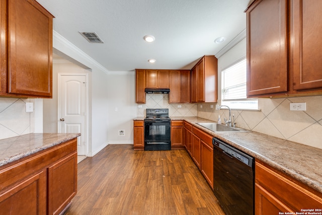 kitchen with sink, black appliances, backsplash, crown molding, and dark hardwood / wood-style flooring