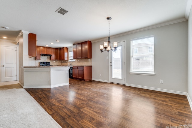 kitchen featuring dark hardwood / wood-style flooring, hanging light fixtures, crown molding, backsplash, and black stove