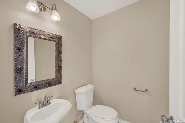 bathroom featuring sink and toilet