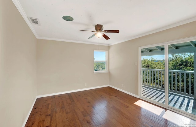 empty room with dark hardwood / wood-style flooring, ceiling fan, and ornamental molding