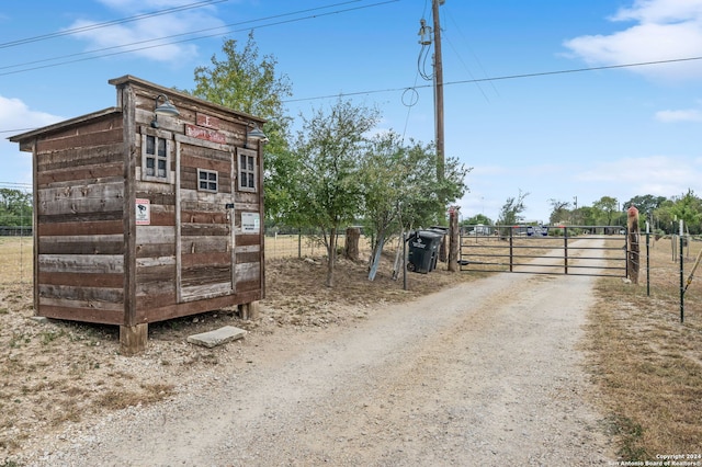 view of outbuilding featuring a rural view